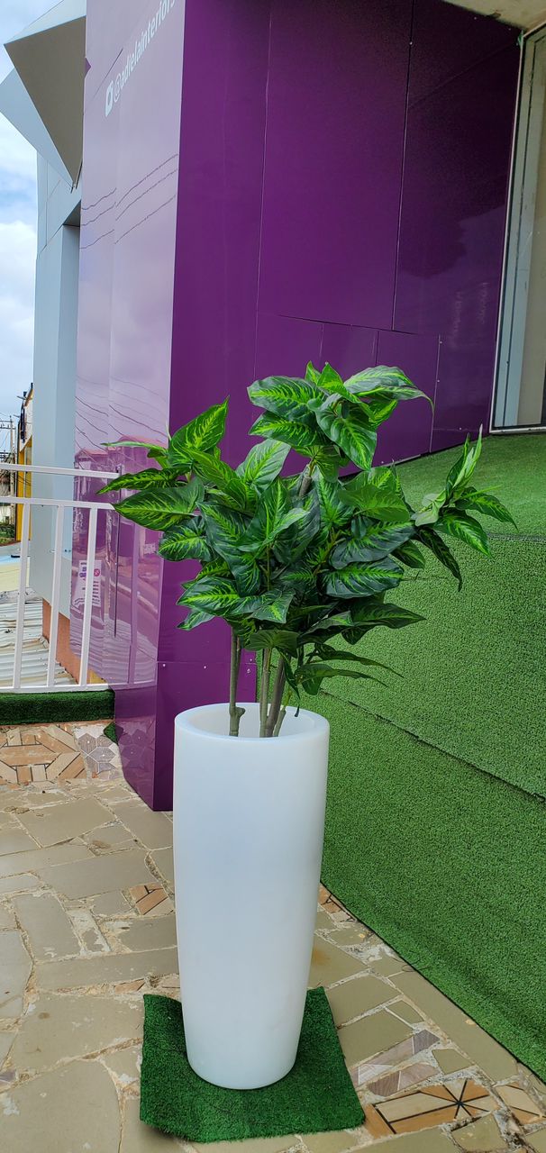 Artificial Tree In Long White Plastic Planter Image