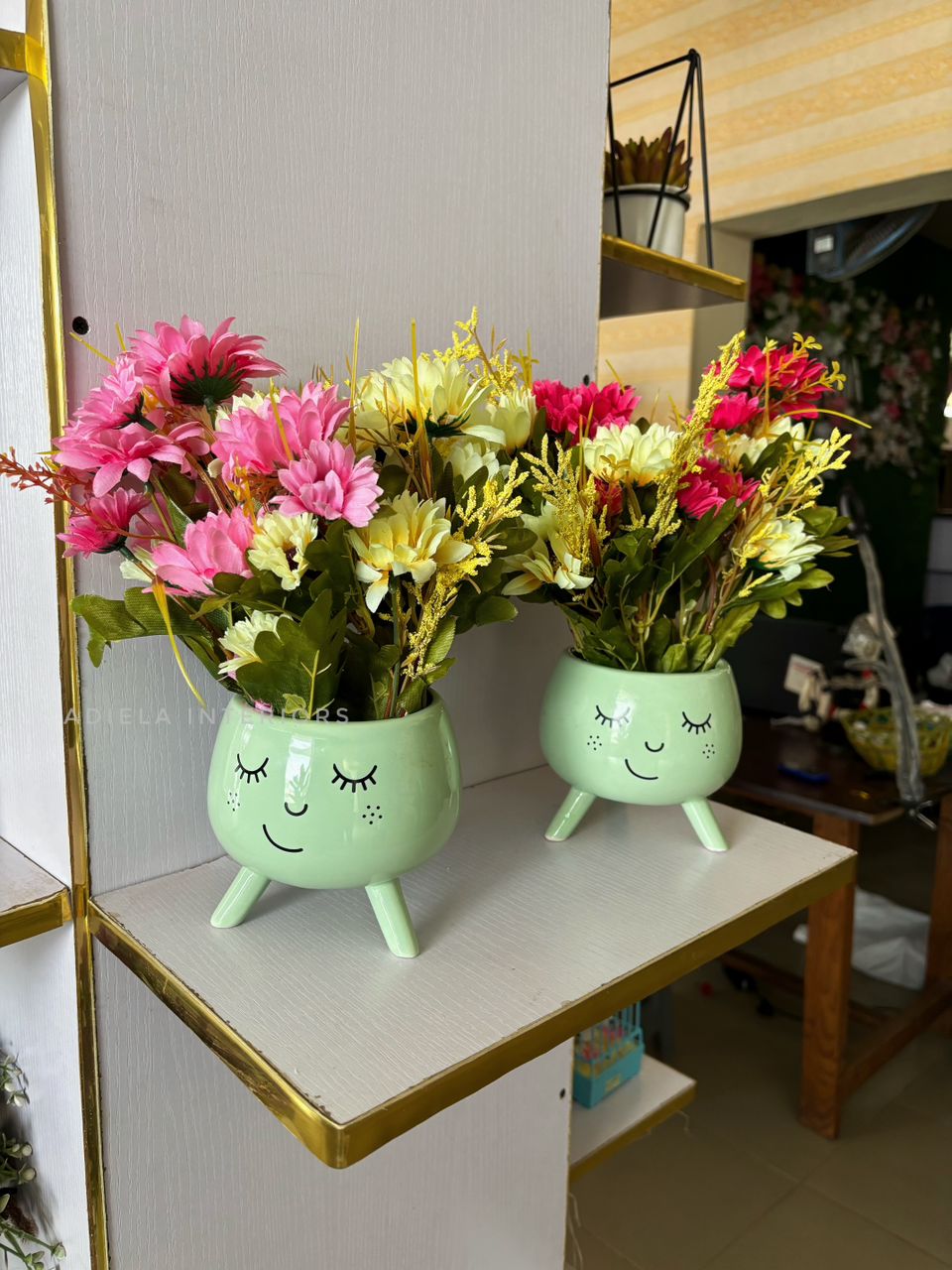 Multicolored Sunflower In Smily Face Vase Image