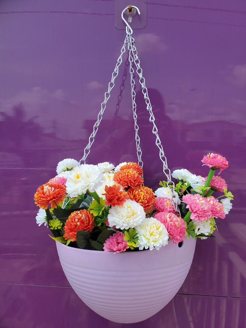Artificial Flower In Hanging Plastic Vase Image