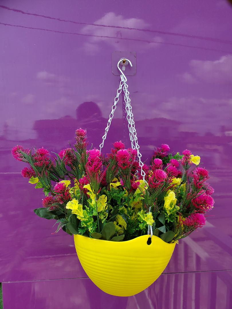 Artificial Flower In Hanging Plastic Vase Image