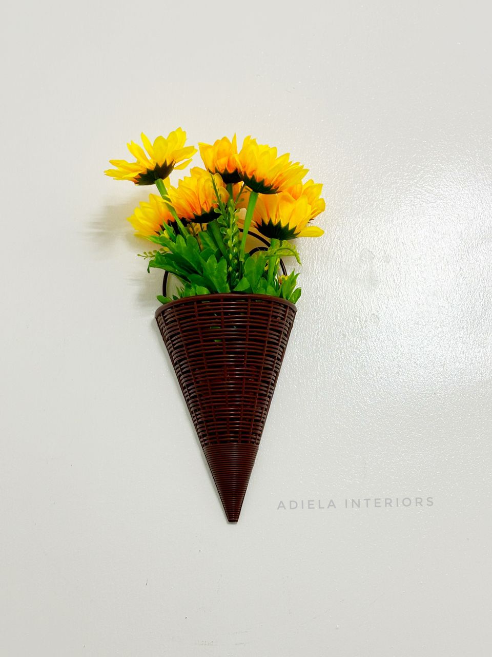 Artificial Sunflower In Plastic Wall Vase Image