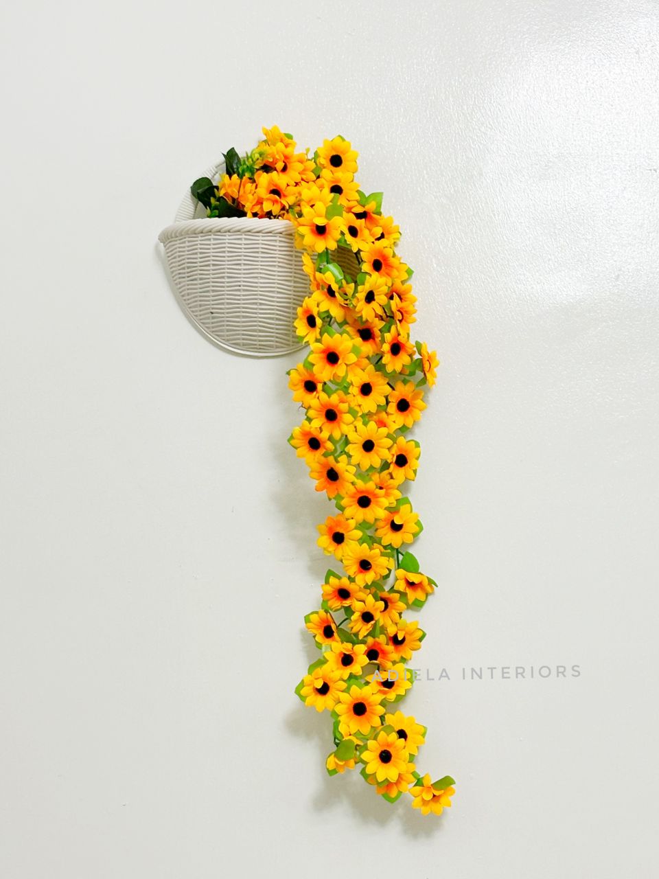 Artificial Dropping Sunflower In Plastic Wall Vase Image