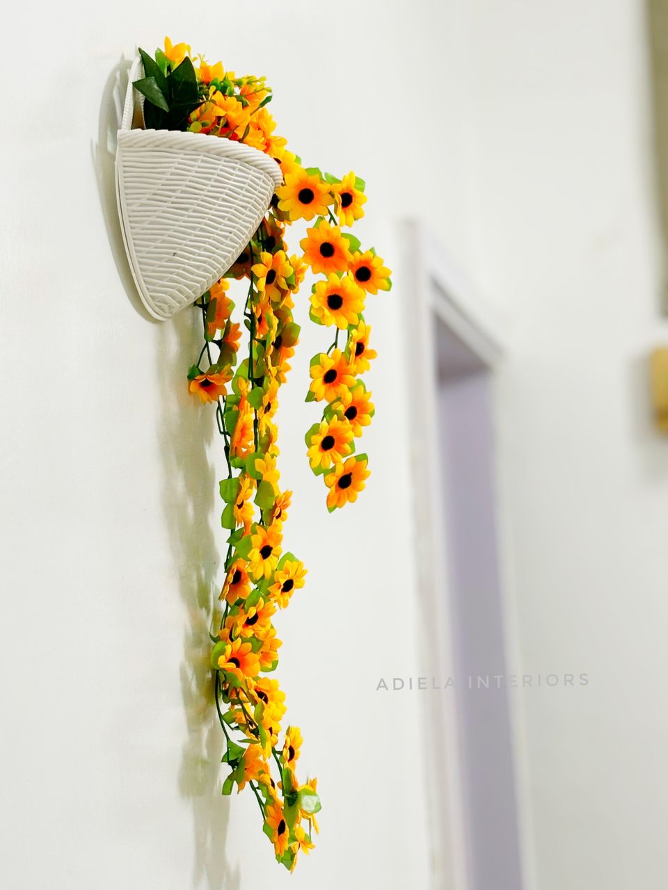 Artificial Dropping Sunflower In Plastic Wall Vase Image