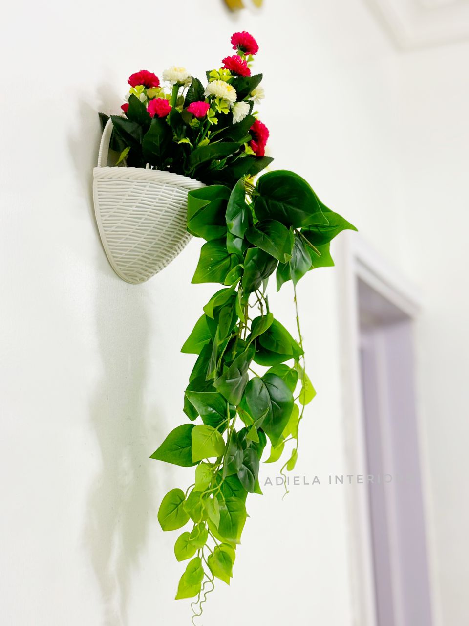 Artificial Flower In Plastic Wall Vase Image