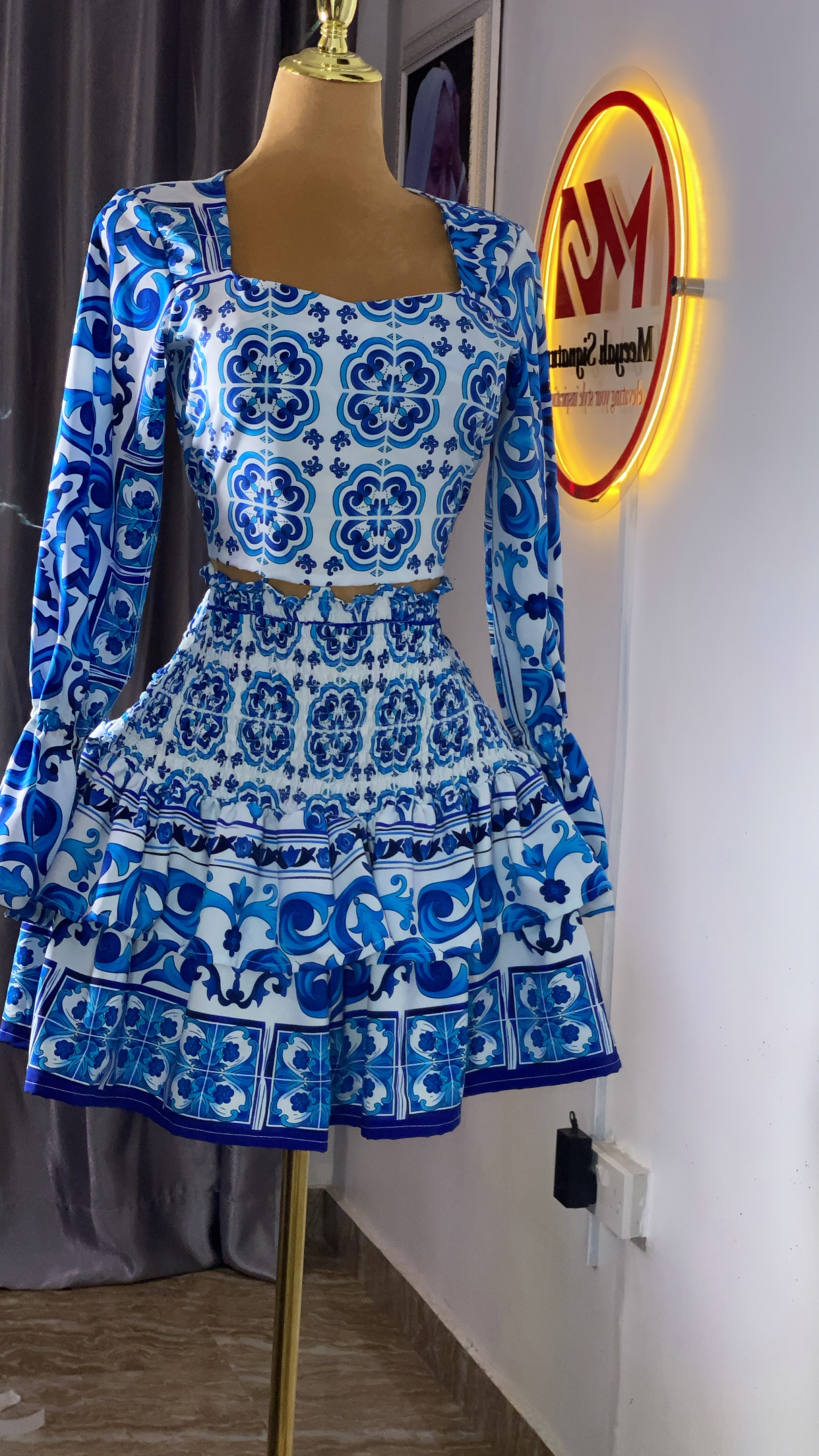 Crop top & smocked high -waist mini skirt