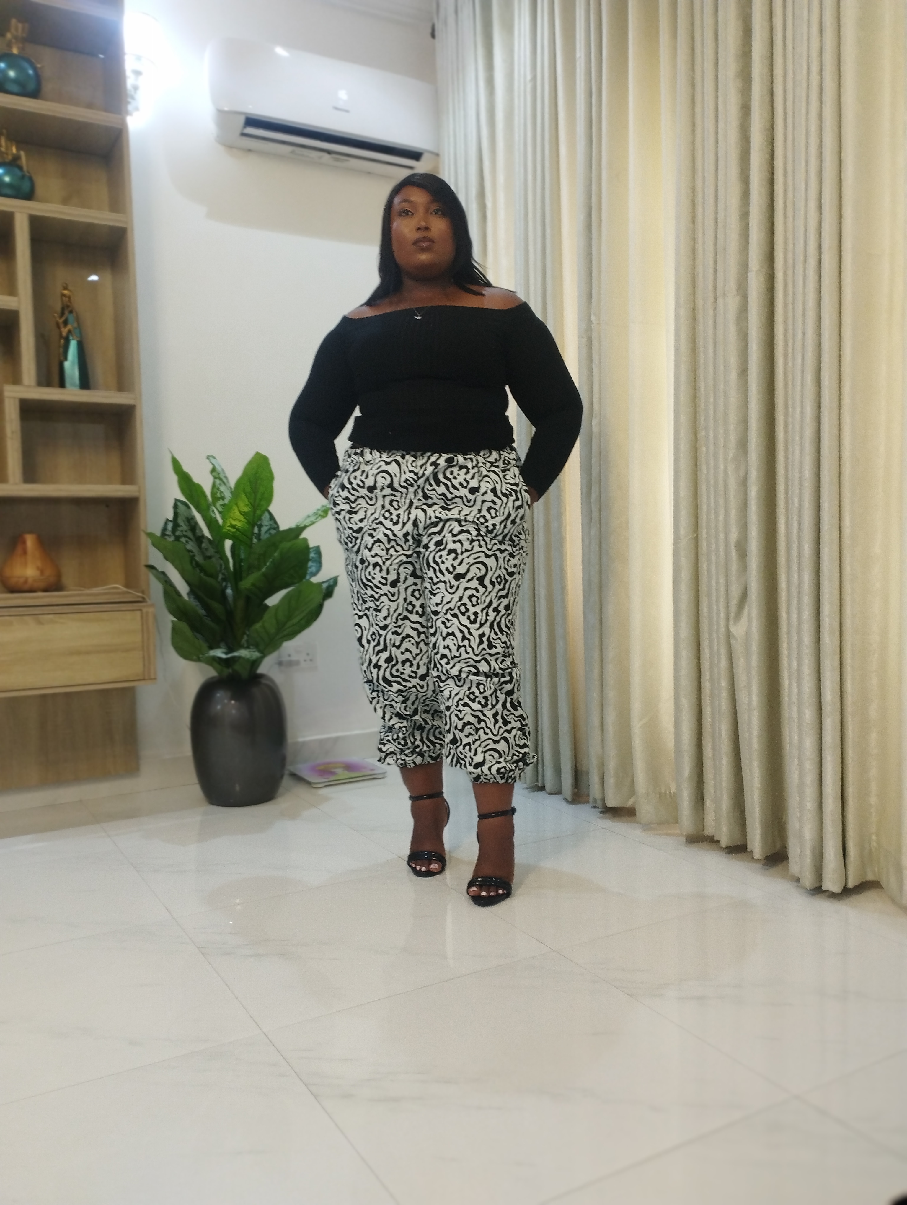 White and black ankara carrot trouser image